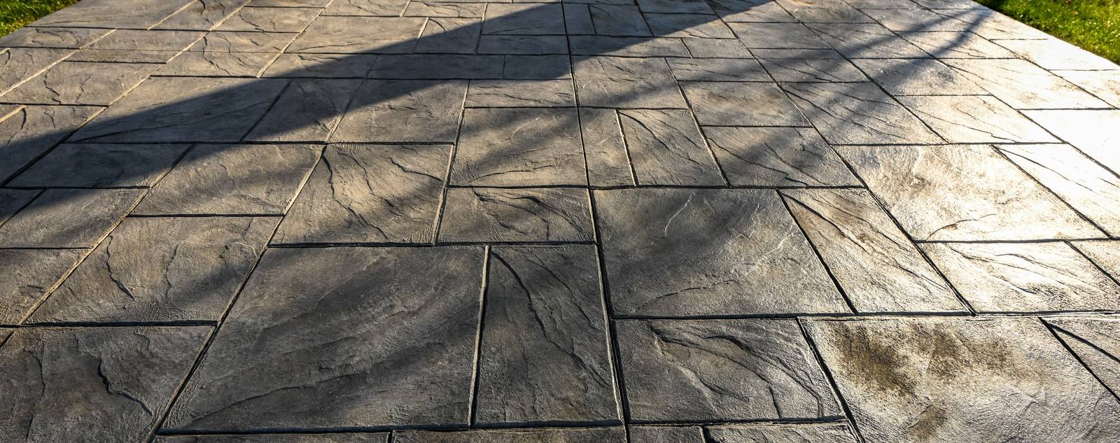 Stamped concrete patio in an ashlar slate pattern, poured by Taber Builders in Batavia, Illinois